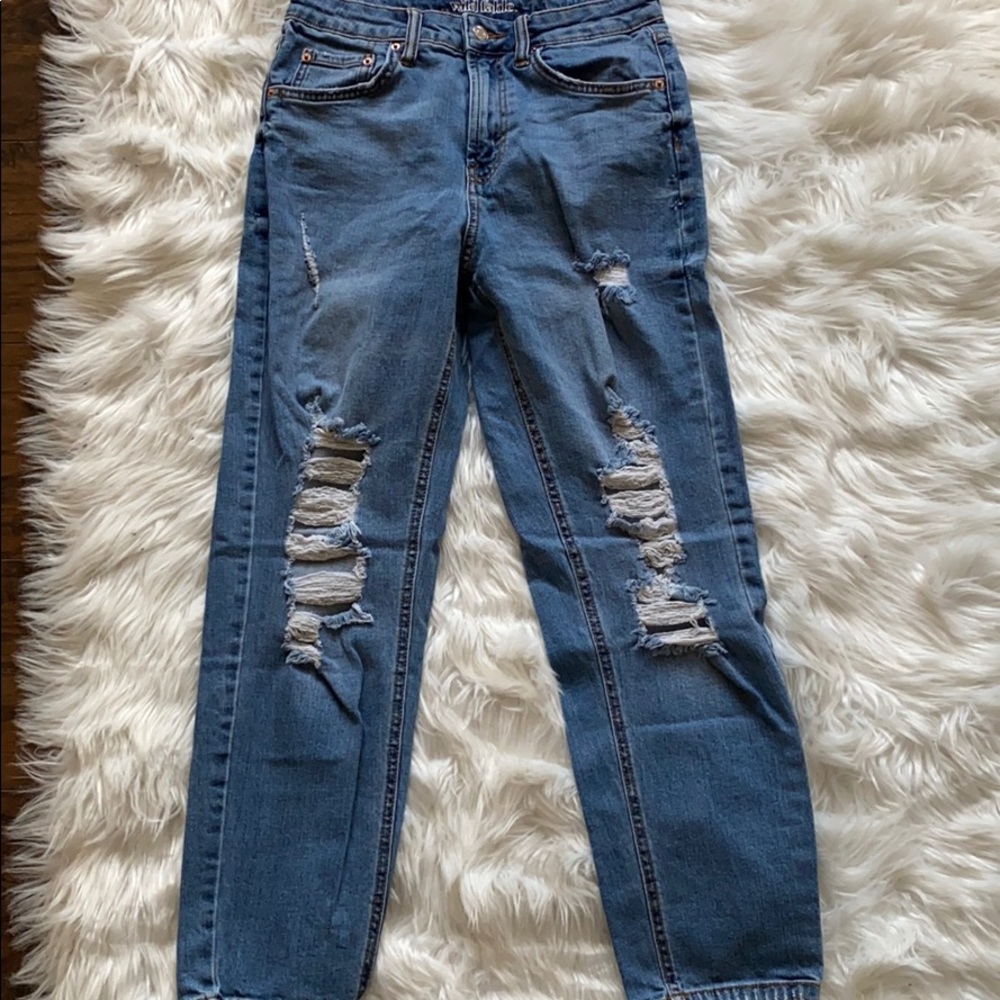 Distressed jeans.